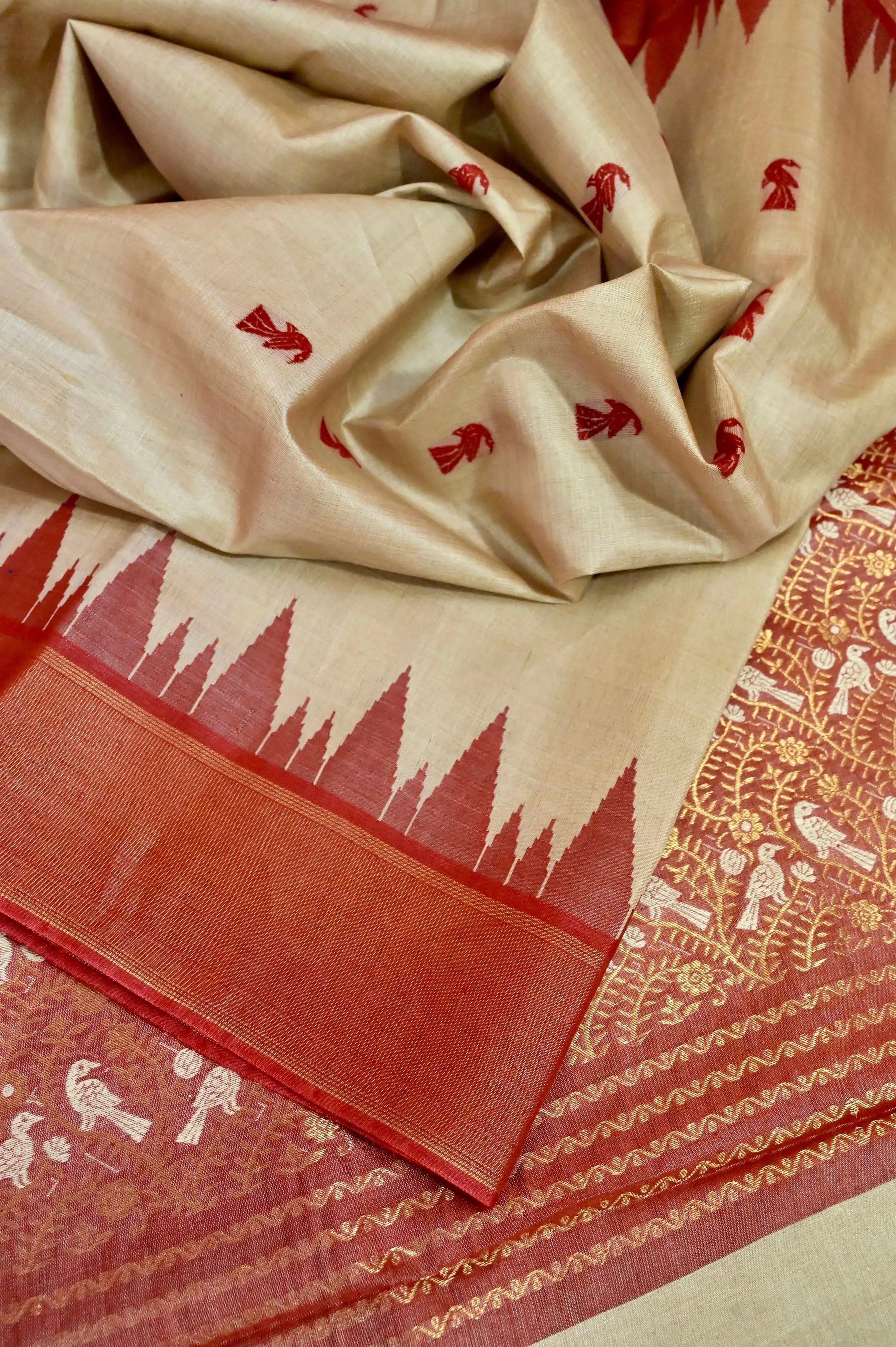 Dark Cream Color Tussar Silk with Allover Red Buti with Temple Border and Zari Weaving